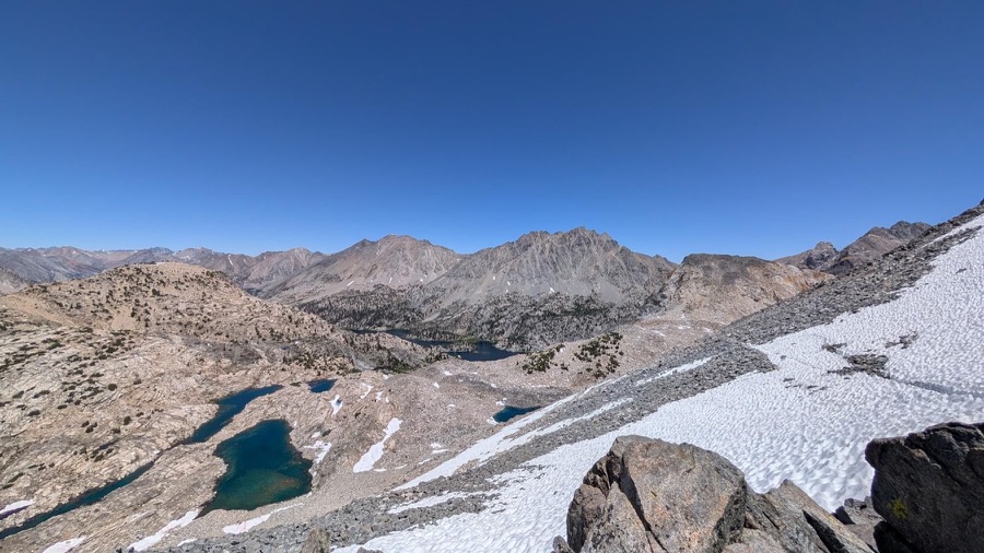 Alpine lakes and snow viewed from Glen Pass