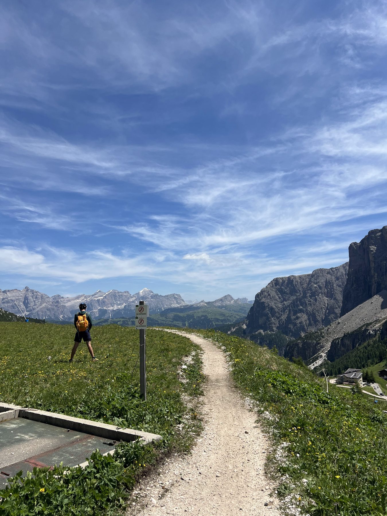 Mountain biker overlooking the Dolomite peaks along the Sellaronda route