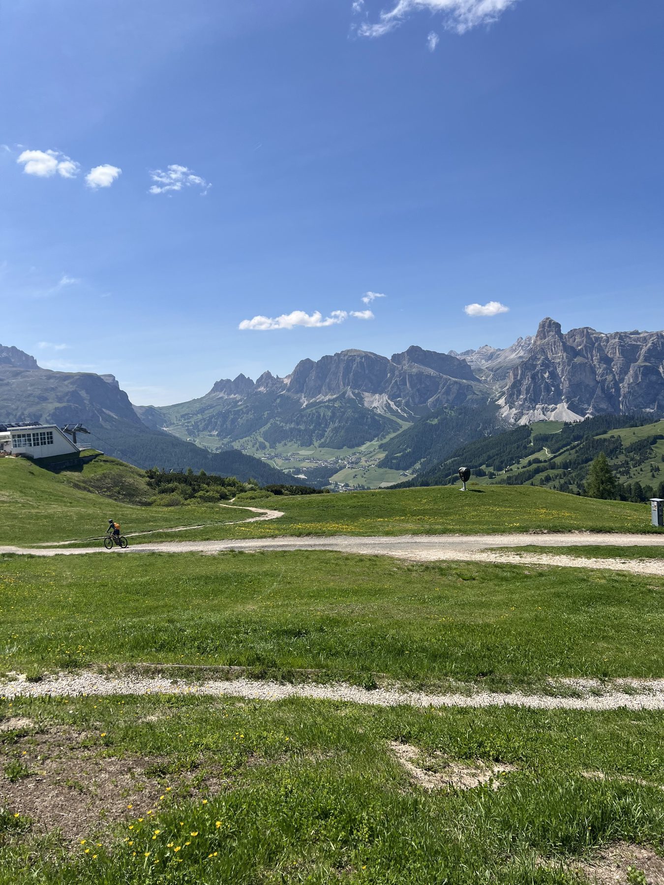 Mountain biker traversing open terrain in the Dolomites