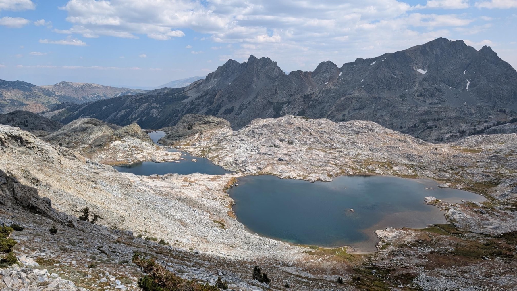Wide view across a rocky alpine basin